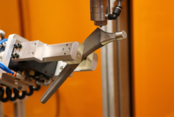 Robotic orthopedic implant masking machine